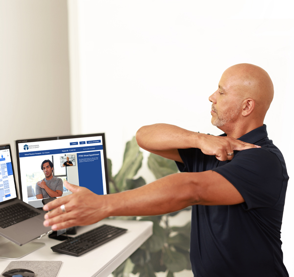 man following exercises on laptop